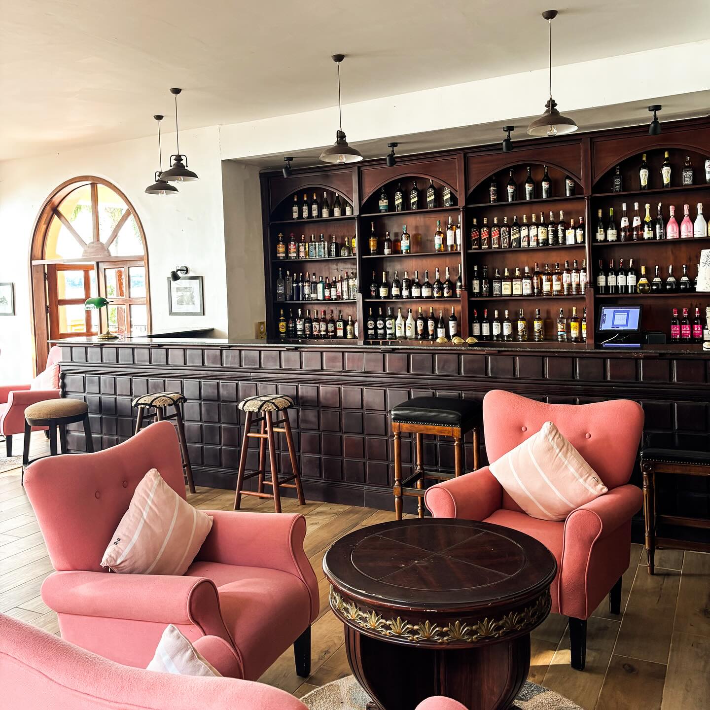 The Victoria Bar with pink armchairs